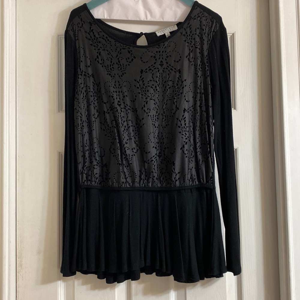 Black long sleeved blouse with layered design on top and flowing bottom